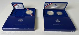 1986 United States Liberty Silver Dollar/Half Dollar Coin Set; and 1986 United States Liberty Silver Dollar Coin 