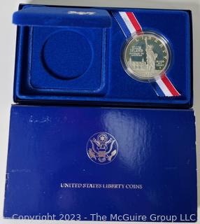 1986 United States Liberty Silver Dollar/Half Dollar Coin Set; and 1986 United States Liberty Silver Dollar Coin 