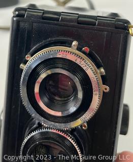 Two (2) Vintage Cameras Including a Kodak Baby Brownie Special and a Soviet LOMO Lubitel 2 Twin Lens Reflex Camera. 