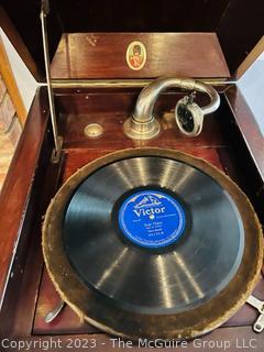 Victrola Commonwealth Trademark Phonograph in Mahogany Record Cabinet with Collection of 78 records and Edison Record.  17"w x 21"d x 41"t 