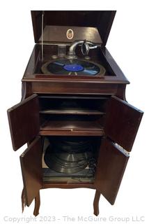 Victrola Commonwealth Trademark Phonograph in Mahogany Record Cabinet with Collection of 78 records and Edison Record.  17"w x 21"d x 41"t 