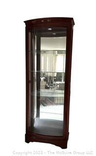 Contemporary Lighted Wood and Glass Bow Front Curio Display Cabinet with Adjustable Glass Shelves, Sliding Side Door and Mirrored Back. This is the second of two  offered in this auction.  26w" x 15"d x 78"t