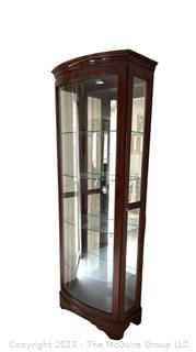 Contemporary Lighted Wood and Glass Bow Front Curio Display Cabinet with Adjustable Glass Shelves, Sliding Side Door and Mirrored Back. This is the second of two  offered in this auction.  26w" x 15"d x 78"t