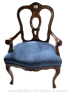 Venetian Style Wood Arm Chair With Blue Seat and Open Back.  This is the first of two offered in this auction. 24"w x 36"t x 19"Seat height