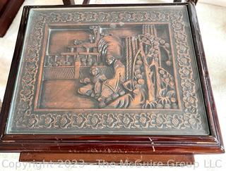 Set of Three (3) Chinoiserie Style Carved Chinese Rosewood Nesting Tables.  Each carved with an individual scene that continues around the edge.  With glass top inserts.  Largest table 17"w x 12"d x 22"t