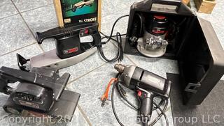 Selection of corded electric hand tools: Vintage Sears Craftsman 315-17480 Router Model 315-17480; drill; saber saw; belt sander