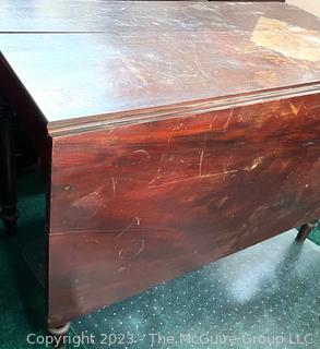 Mahogany Drop Leaf Dining Table.  Damage to top.  42" x 21"x 29"t 