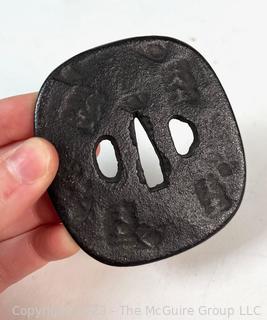 Japanese Iron Nagamaru Tsuba for Samurai Sword.   A tsuba is a sword guard and is mounted between the sword's blade and grip to protect the user's hands.