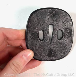 Japanese Iron Nagamaru Tsuba for Samurai Sword.   A tsuba is a sword guard and is mounted between the sword's blade and grip to protect the user's hands.