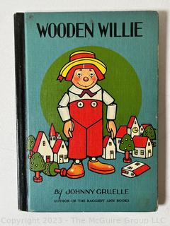 Three (3) Childrens Books Including Wooden Willie, Raggedy Ann and Mike Mars. 