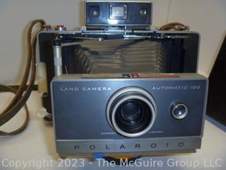 Polaroid Automatic 100 Land Camera. Appears to be in working condition and contains film