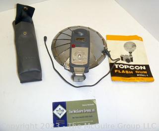 Vintage camera equipment: TOPCON Flash attachment, Flash bar, and GE light meter