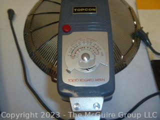 Vintage camera equipment: TOPCON Flash attachment, Flash bar, and GE light meter