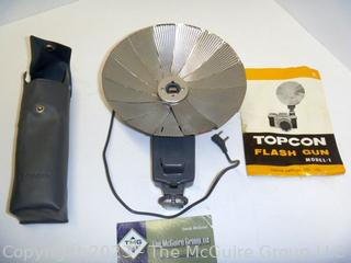 Vintage camera equipment: TOPCON Flash attachment, Flash bar, and GE light meter