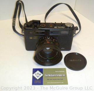 Vintage Yashica Electro 35 , film camera. 45mm lens, Untested but mechanics (shutter) appear to work. Cannot access battery portal