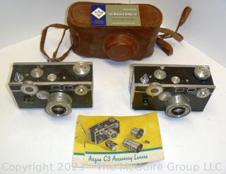 Selection of TWO (2) ARGUS C3 35mm film cameras; one leather camera case; both clean and mechanically working