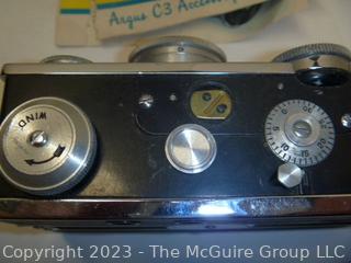 Selection of TWO (2) ARGUS C3 35mm film cameras; one leather camera case; both clean and mechanically working