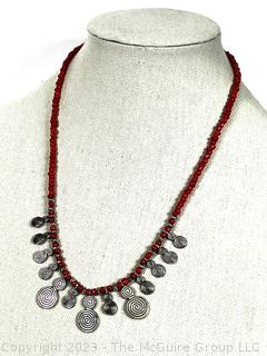 Red Bead with Hammered Metal Pendants. 