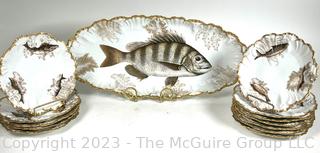 Antique Tressemann & Vogt Limoges Hand Painted Porcelain Fish Set with 12 Plates and a Platter.  One handle of platter has been damaged.  