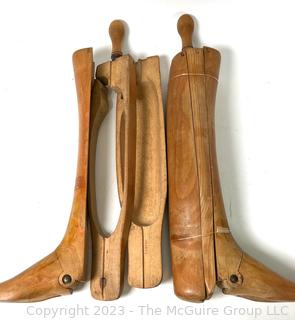 Two (2) Antique Equestrian Wood Boot Keeps or Forms. This pair of boot stretchers from the late 1800's separate into three sections that are dovetailed together with hinged toe and handle grip. 