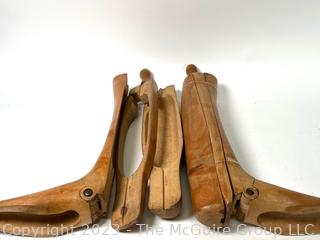 Two (2) Antique Equestrian Wood Boot Keeps or Forms. This pair of boot stretchers from the late 1800's separate into three sections that are dovetailed together with hinged toe and handle grip. 