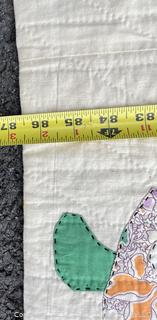 Hand Stitched Flour Sack Quilt in Sunbonnet Sue Pattern. 73" x 87"