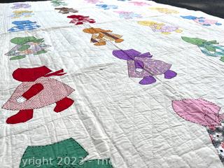 Hand Stitched Flour Sack Quilt in Sunbonnet Sue Pattern. 73" x 87"