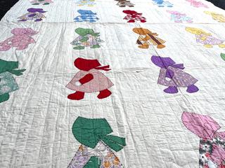 Hand Stitched Flour Sack Quilt in Sunbonnet Sue Pattern. 73" x 87"