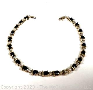 14kt Yellow Gold Sapphire and Diamond Tennis Bracelet with Safety Clasp.  Stone missing.  