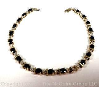 14kt Yellow Gold Sapphire and Diamond Tennis Bracelet with Safety Clasp.  Stone missing.  