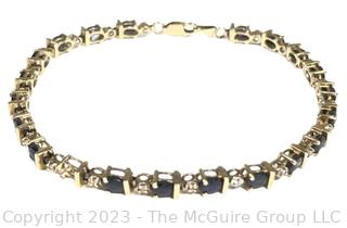 14kt Yellow Gold Sapphire and Diamond Tennis Bracelet with Safety Clasp.  Stone missing.  