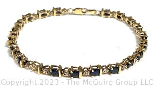 14kt Yellow Gold Sapphire and Diamond Tennis Bracelet with Safety Clasp.  Stone missing.  