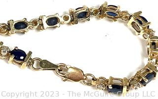 14kt Yellow Gold Sapphire and Diamond Tennis Bracelet with Safety Clasp.  Stone missing.  