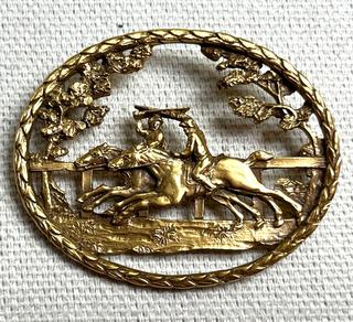 Openwork Brooch Featuring Horses Racing Marked CWF. 