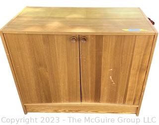 Heavy Mid Century Pine Two Door Cabinet.  First of three offered in this auction.  20" x 28" x 35"