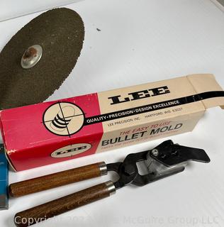 Group of Household Items Including Racquet Game and Bullet Mold