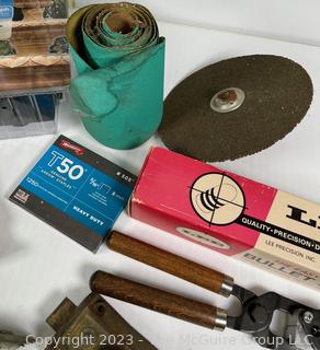 Group of Household Items Including Racquet Game and Bullet Mold