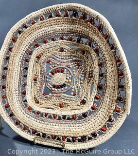 Woven Tribal Basket with Carved Vase.