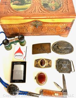 Belt Buckles, Bollo Tie, Zippo Lighter, Pocket Knife in a Wood Box. 