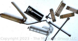 Group of Tools including Grease Guns, Calipers, Vintage Tire Iron and Numerous Folding Rules