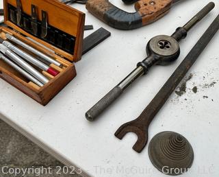 Group of Tools including Tap and Die Set, Galvanized Funnel, Bench Vise, NIB Circular Saw Blade, Knife with Leather Sheath and Keyhole Saw