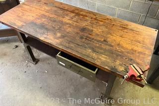 Metal Frame Work Table with Lower Shelf, 1 Drawer and Wooden Top and with Attached Bench Vise. Measures 72L x 30D x 34"T