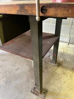 Metal Frame Work Table with Lower Shelf, 1 Drawer and Wooden Top and with Attached Bench Vise. Measures 72L x 30D x 34"T