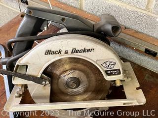 Group of Tools including Black and Decker Electric Circular Saw and Replacement Blades, New Tire, Norton Sanding Belts, 36" Metal Level and Vintage Industrial Style Table Lamp 