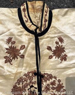 Antique Chinese Hand Embroidered Robe in Oyster Silk with Metallic Thread.  Some discoloration. 