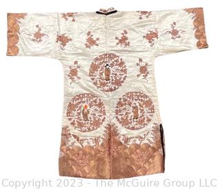 Antique Chinese Hand Embroidered Robe in Oyster Silk with Metallic Thread.  Some discoloration. 