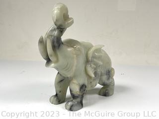 Carved Green Stone Elephant.  Small chip.  7" x 8".