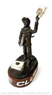 Cast Bronze of Newsboy Signed by Artist Jim McCartin (1919 - 1999) on Wood Base.  13" tall. 