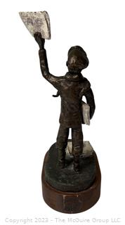 Cast Bronze of Newsboy Signed by Artist Jim McCartin (1919 - 1999) on Wood Base.  13" tall. 