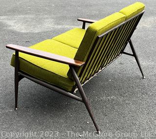 Mid Century Modern Steel Framed Sofa with Walnut Armrests and Green Cushions.  50" long